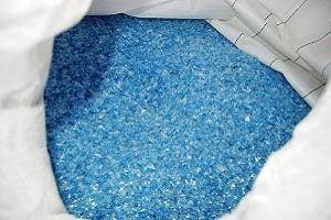 Processed blue PET flakes suitable for various industrial recycling applications.